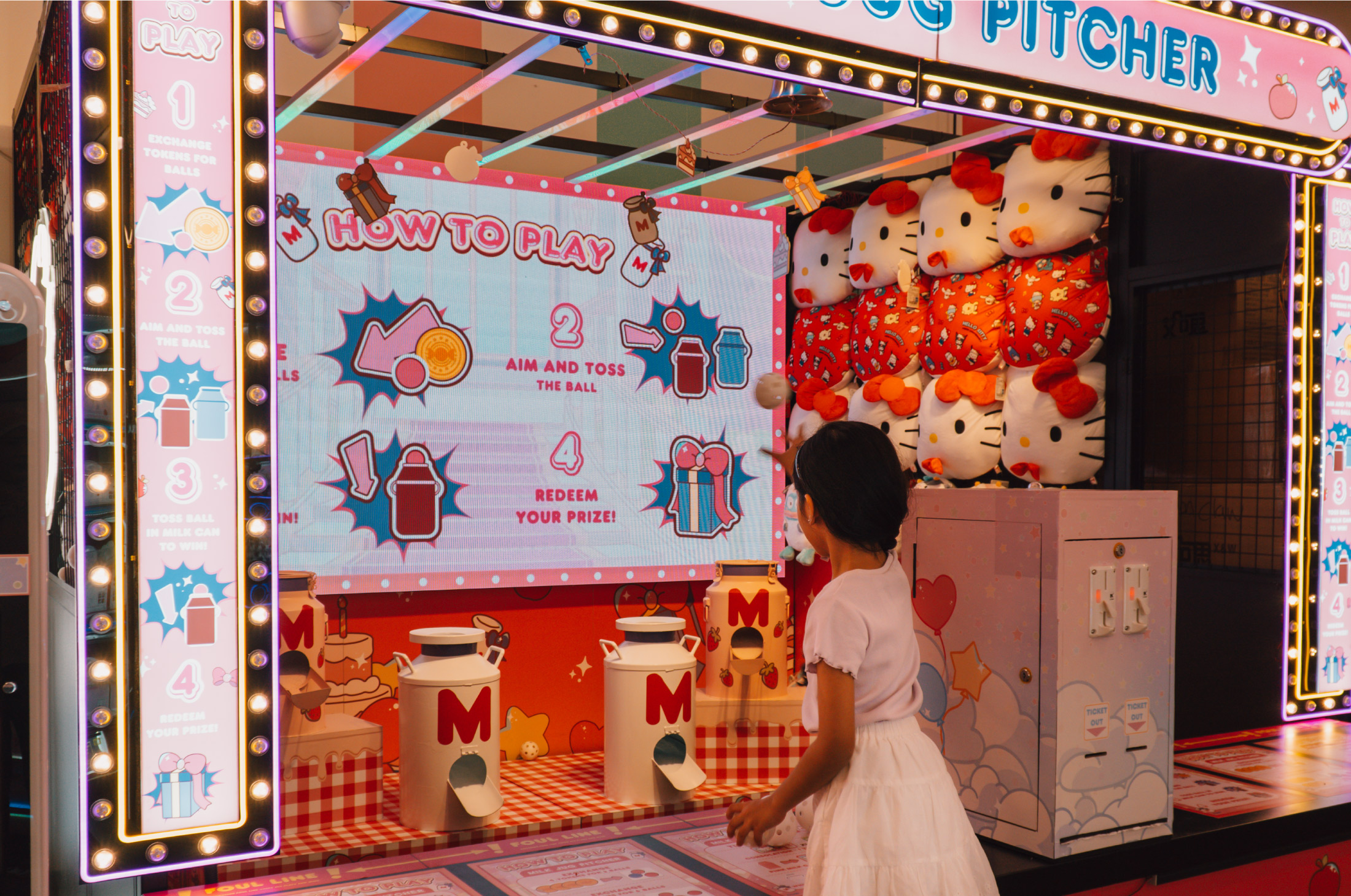 Kid playing Milk Jug Pitcher at Carnival with Hello Kitty and Friends at Changi Airport 